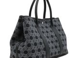 a black and white tote bag with a geometric pattern