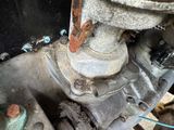a close up of a motorcycle engine with rust on it