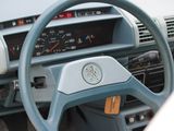 dashboard of a car with a steering wheel and a clock