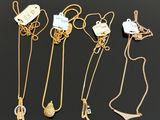a collection of gold necklaces and pendants