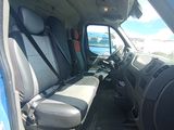 a view of the inside of a truck with the driver ' s seat down