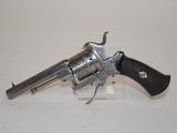 a silver revolver with a black handle on a white surface