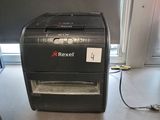 a paper shredder sitting on a counter in a kitchen
