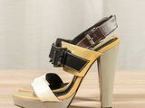 a close up of a pair of shoes on a wooden table