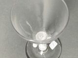 a wine glass that is sitting on a table