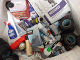 a white bag full of cleaning products and other items