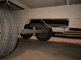 a tire that is underneath a truck in a garage