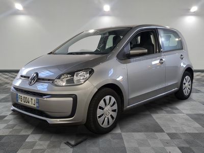 a picture of a small silver car parked in a garage