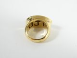 a close up of a gold ring with diamonds on a white surface