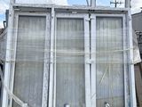 a large window that is sitting on top of a building