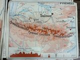 several maps of the mountains and rivers of france on a wooden table