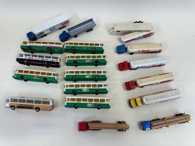 many different types of toy trains and trucks on the table