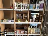 a pantry with a lot of bottles and containers on the shelves