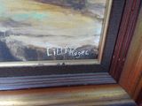 une photo d'un tableau représentant une plage, posé sur le rebord d'une fenêtre