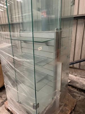 a glass display case in the middle of a pallet