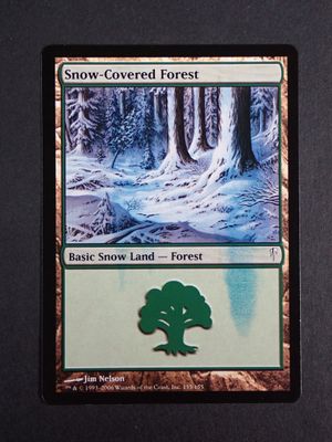 a close up of a card with a tree in the middle of it