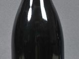 a bottle of wine sitting next to a bottle of wine