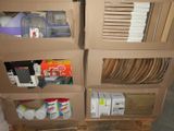 a cardboard carton filled with many different types of items
