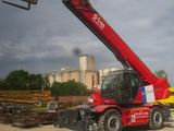 a red crane that is sitting on the back of a truck