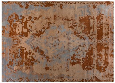 a brown and blue rug with a rusted design on it