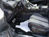the interior of a car with the front seats folded down