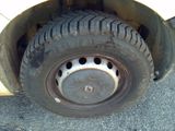 a close up of a flat tire on a vehicle