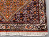 a close up of a rug on a floor with a white background