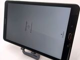 a cell phone that is sitting on top of a stand