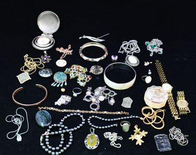 many different types of jewelry on a black table