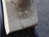 a close up of a parking meter with dirt on it