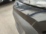 a close up of a car ' s headlight on the front of the car
