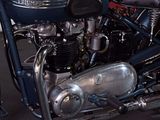a blue motorcycle that is parked in a garage