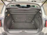 a trunk of a small car with its doors open
