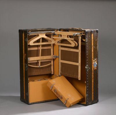 a suitcase that is open and has a coat hanger in it