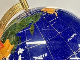 a blue globe with a map of the world on it