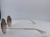a pair of sunglasses sitting on top of a white table