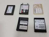 several different types of hard drives are laid out on a table