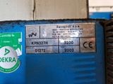 a close up of a blue machine with a label on it