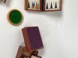 a small wooden box with a game set inside of it
