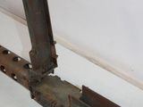an old machine gun that is sitting on the floor