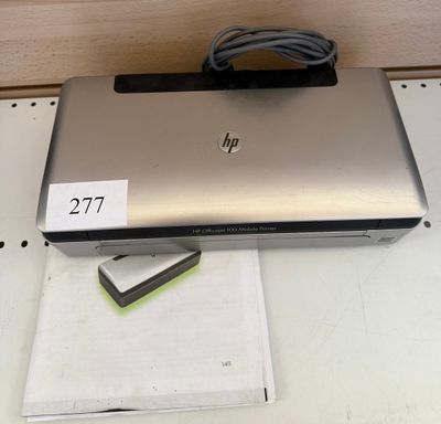 a laptop computer sitting on top of a table