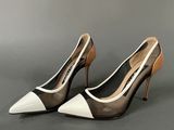 a close up of a pair of shoes on a gray surface