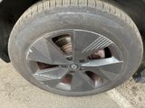 a close up of a tire on the side of a car