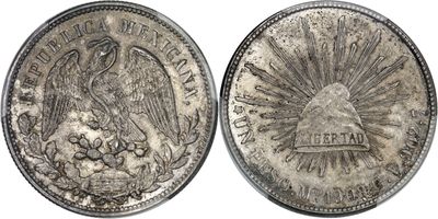 a close up of a coin with a bird on it