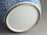 a blue and white vase sitting on a table