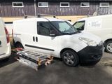 a white van that is parked in a parking lot