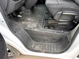 the interior of a car with the door open and the seats down