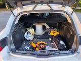 a trunk of a car with tools inside of it