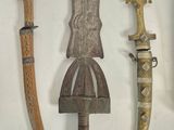 several different types of weapons are displayed on a wall