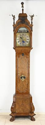 a grandfather clock that is standing in a room